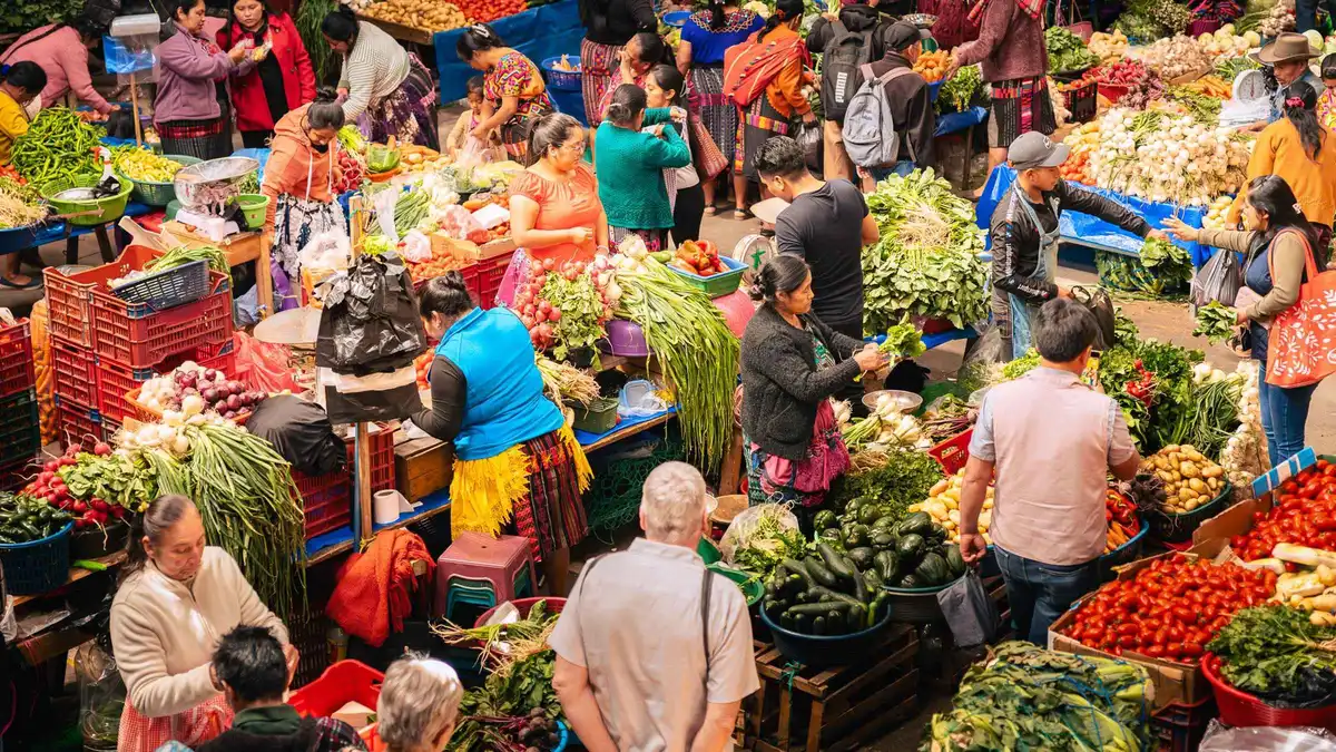 Crowded textile stalls of the Chichicastenango market day trip from Antigua