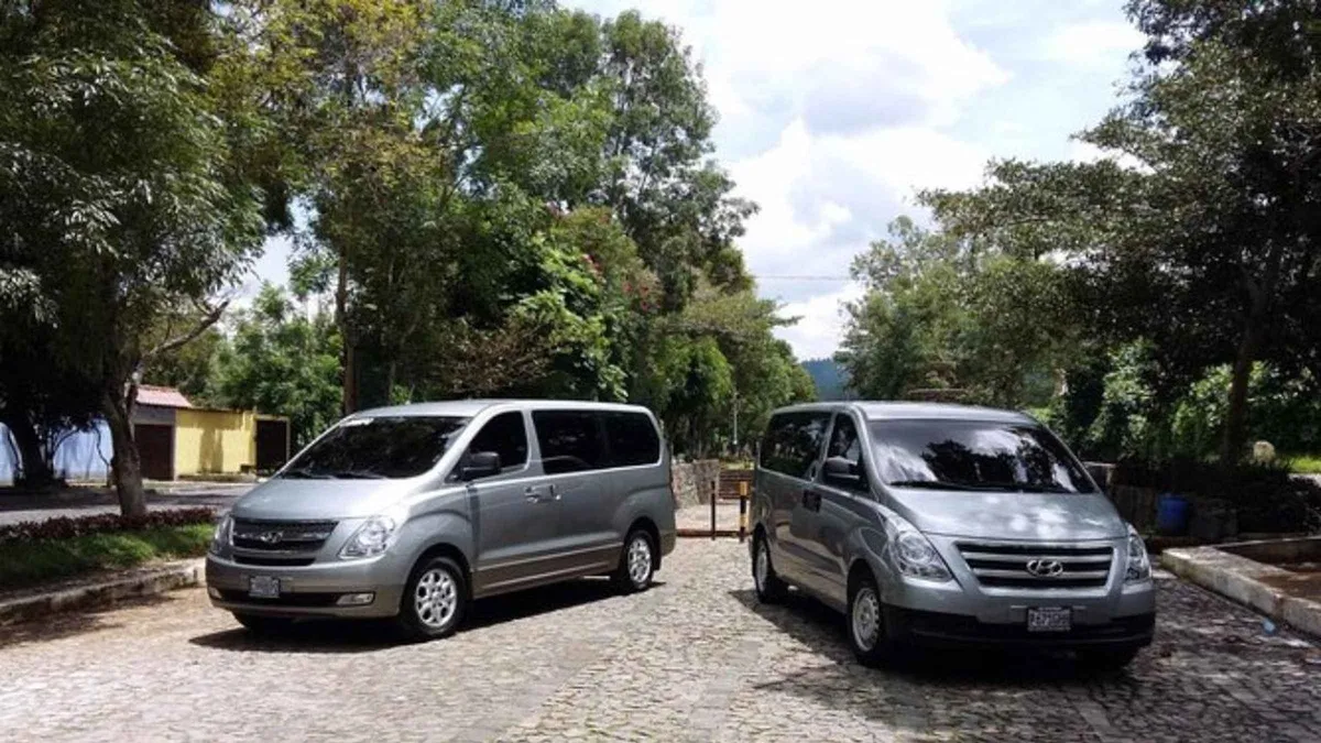 Private transfer van meeting arrivals at La Aurora airport for the Antigua Guatemala run